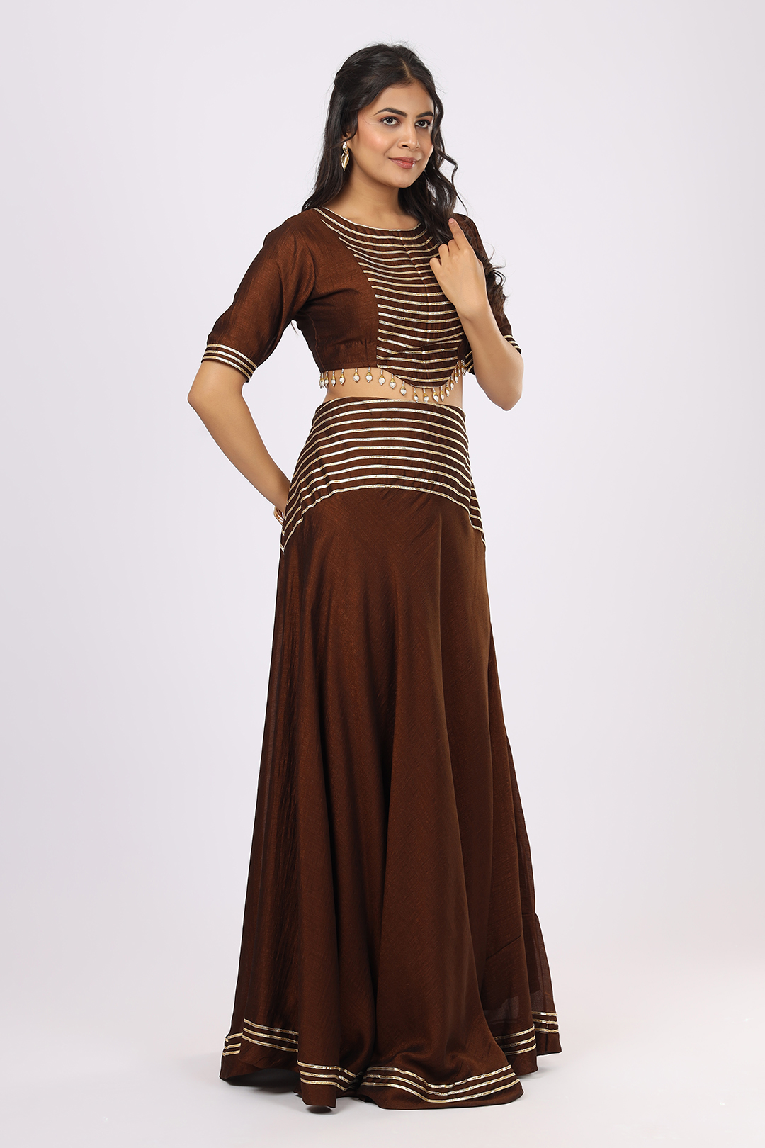 VGlame Women’s Three-Piece Brown VSilk Set – Crop Top, Flared Skirt and Dupatta with Gota Work
